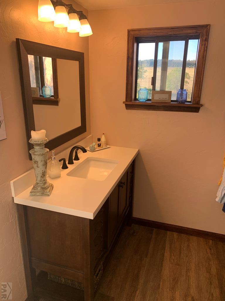 8419 3 R Road Beulah, CO 81023 - Photo 22 of 46 a bathroom with a sink vanity and mirror