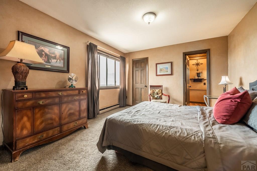 8419 3 R Road Beulah, CO 81023 - Photo 23 of 46 a bedroom with a bed and dresser