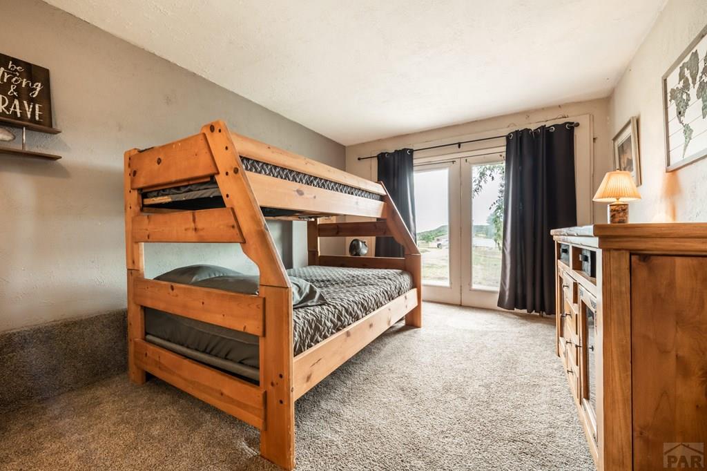 8419 3 R Road Beulah, CO 81023 - Photo 29 of 46 a bedroom with furniture and a window