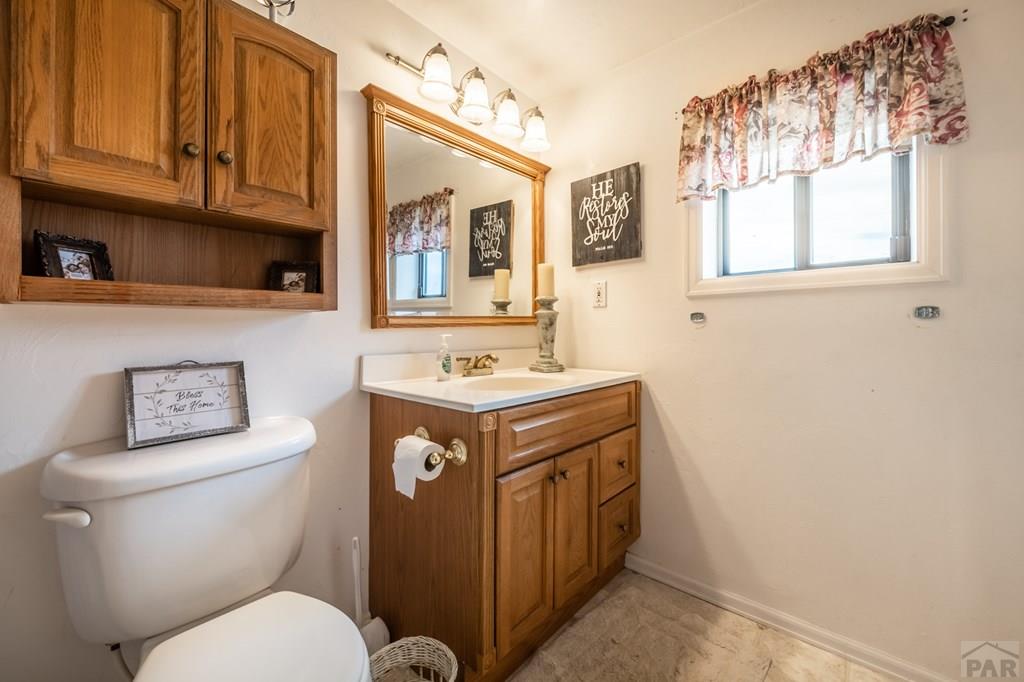 8419 3 R Road Beulah, CO 81023 - Photo 31 of 46 a bathroom with a toilet sink and mirror