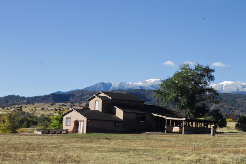 8419 3 R Road Beulah, CO 81023 - Photo 41 of 46 a front view of a house with a yard