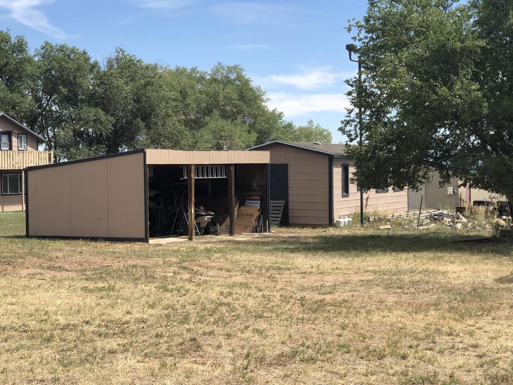 8419 3 R Road Beulah, CO 81023 - Photo 45 of 46 a view of a house with a yard and garage