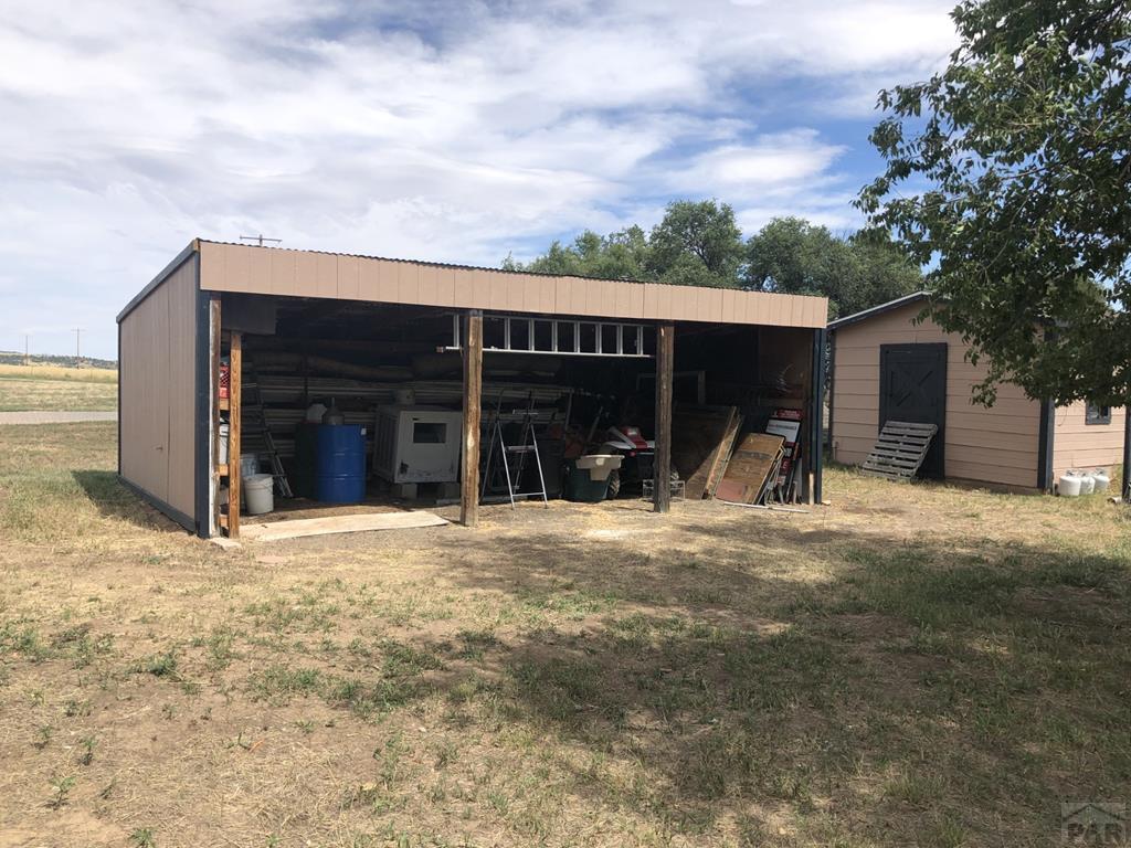 8419 3 R Road Beulah, CO 81023 - Photo 46 of 46 a view of a house with a yard and garage