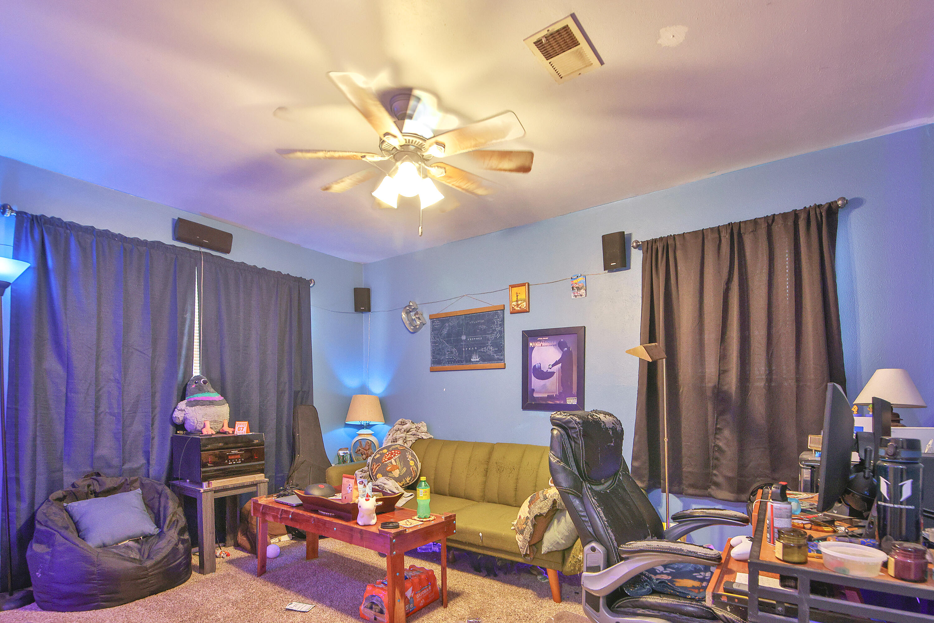 4518 49th Street Lubbock, TX 79414 - Photo 15 of 32 a living room with furniture and a chandelier