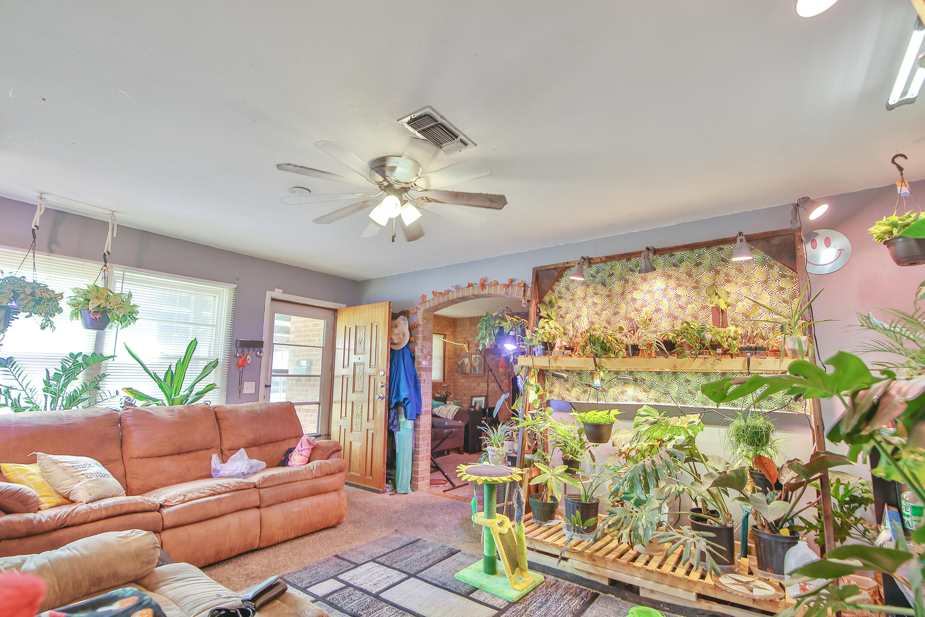 4518 49th Street Lubbock, TX 79414 - Photo 26 of 32 a living room with furniture and a large window