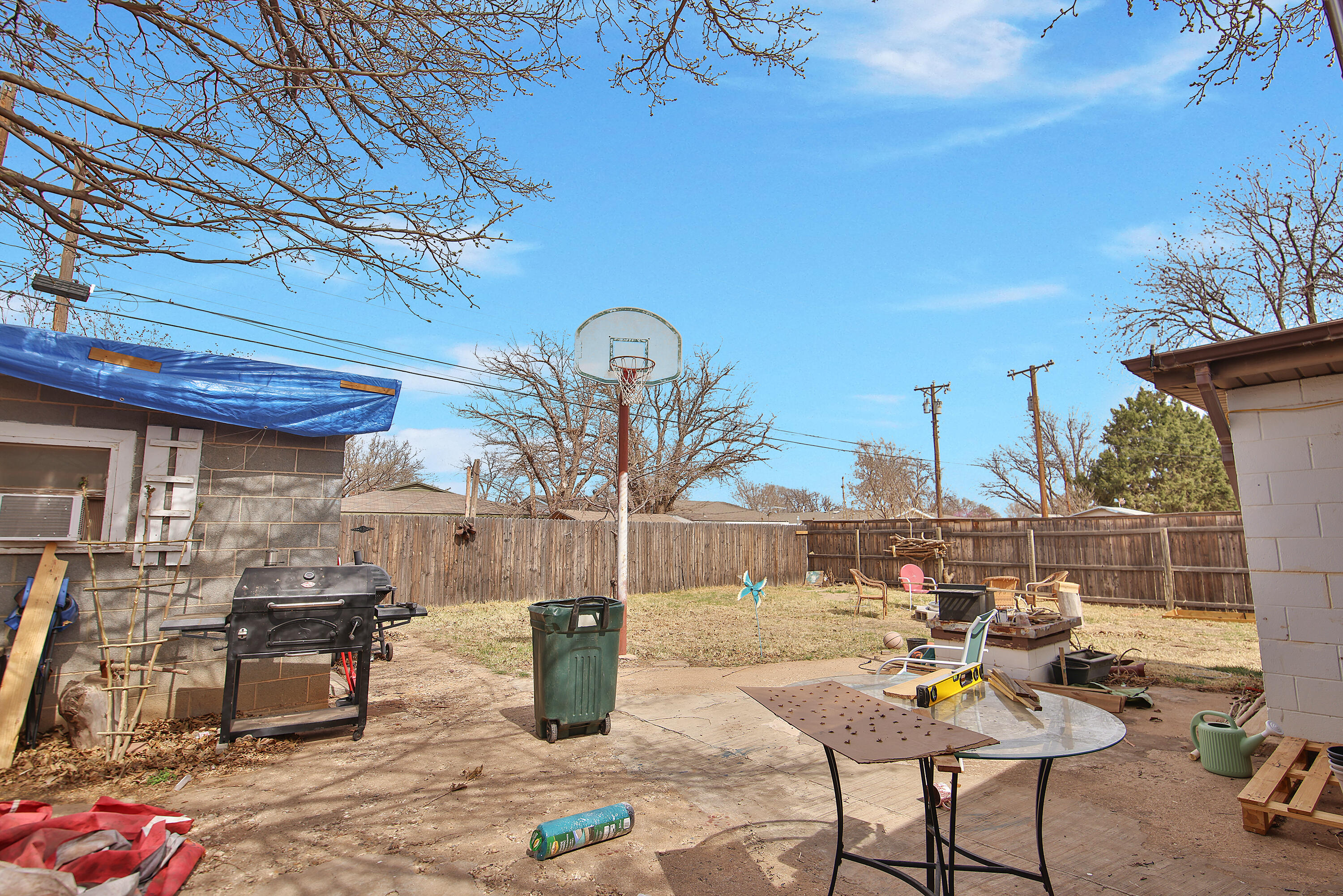4518 49th Street Lubbock, TX 79414 - Photo 27 of 32 a view of a chairs and tables in the patio
