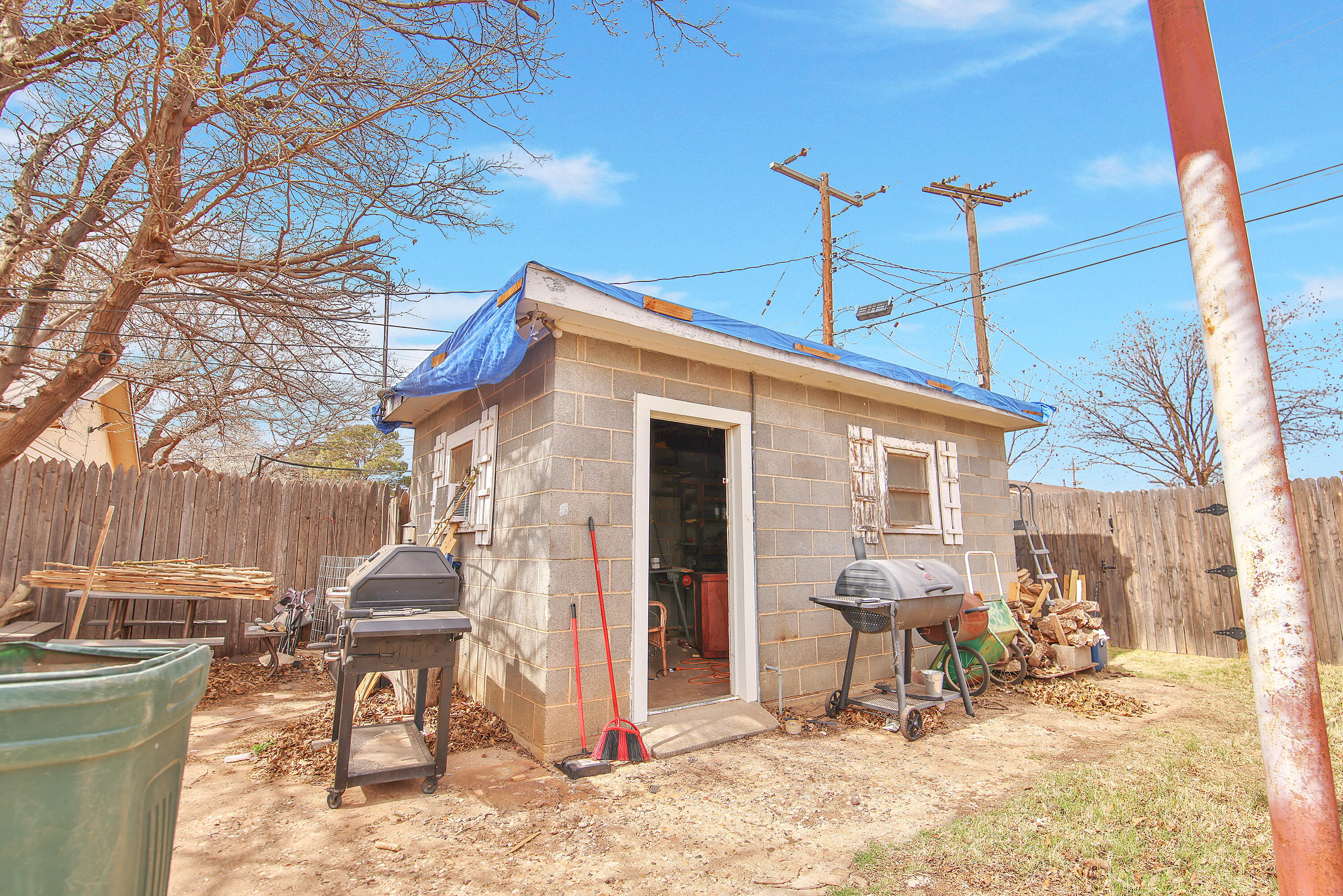 4518 49th Street Lubbock, TX 79414 - Photo 28 of 32 a view of a chairs and a table in the patio
