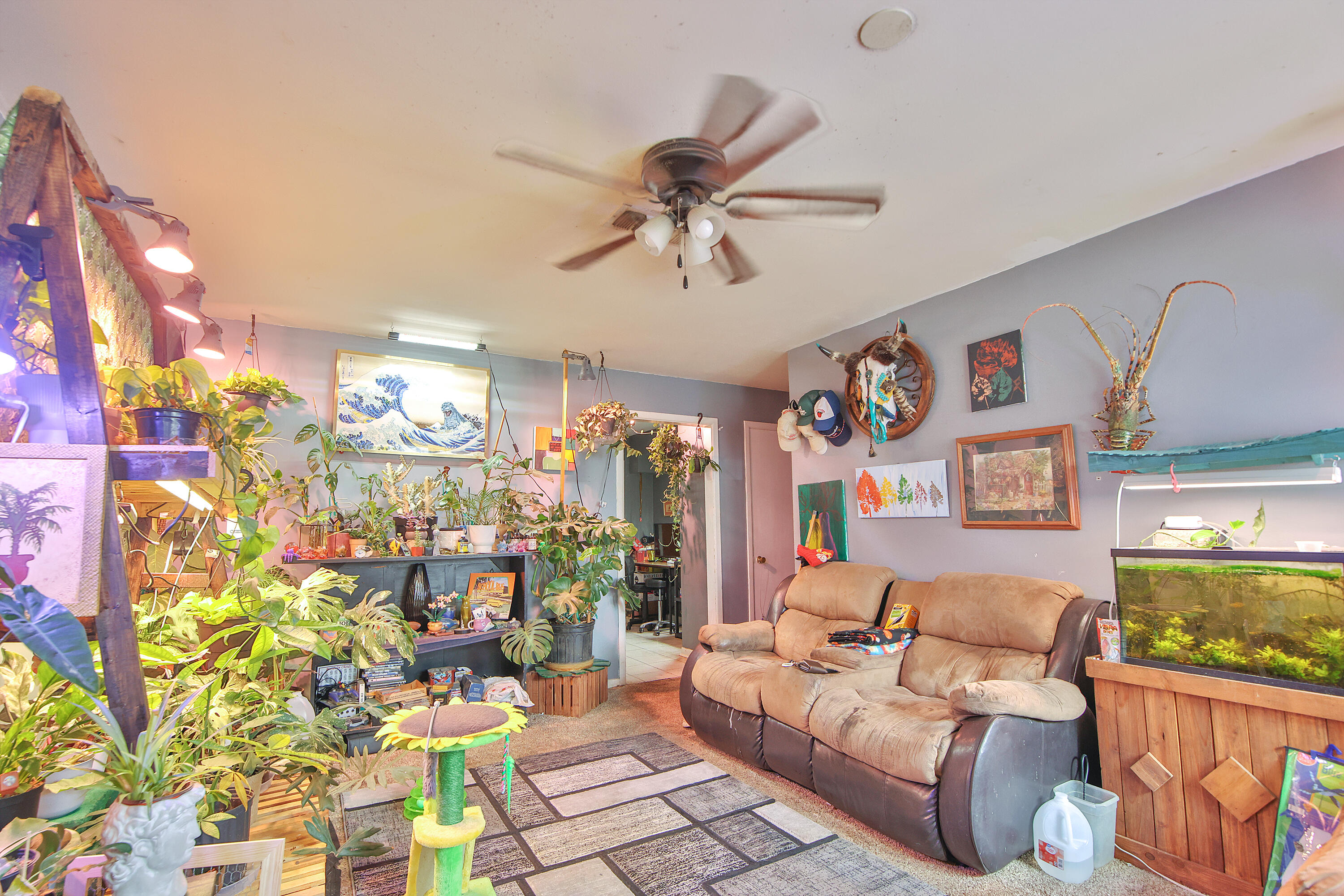 4518 49th Street Lubbock, TX 79414 - Photo 3 of 32 a living room with patio furniture and a chandelier