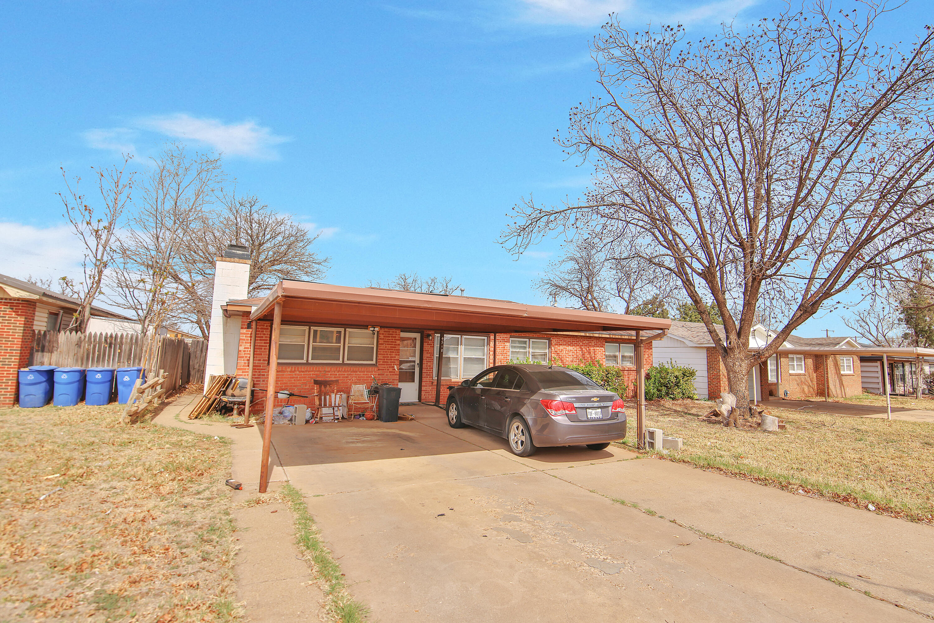 4518 49th Street Lubbock, TX 79414 - Photo 32 of 32 a car parked in front of a building