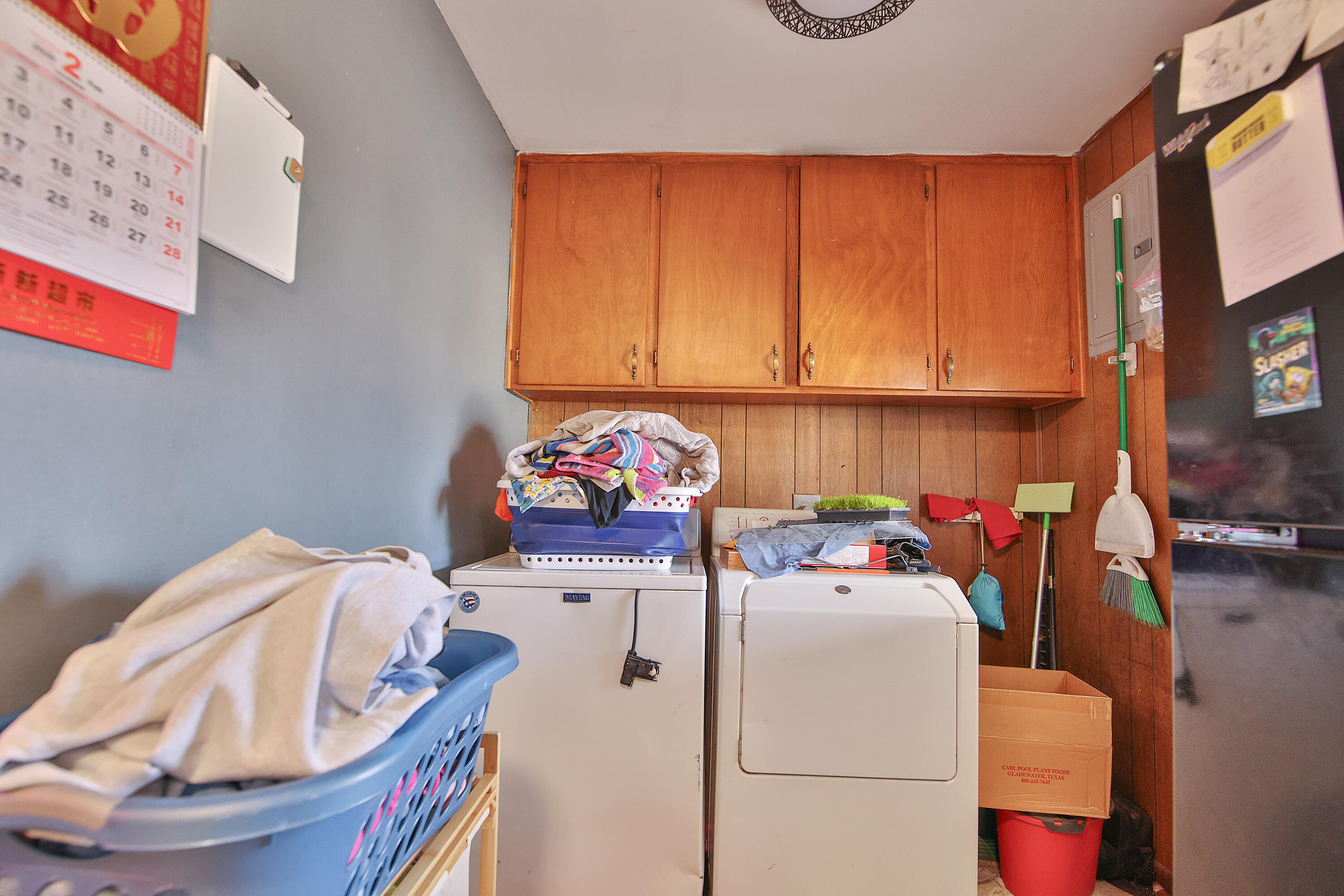 4518 49th Street Lubbock, TX 79414 - Photo 7 of 32 a utility room with washer and dryer