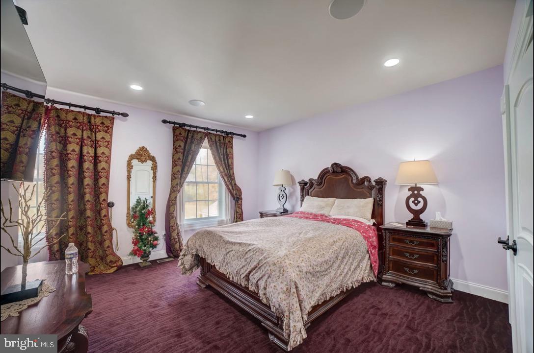 11561 Stuart Mill Road Oakton, VA 22124 - Photo 40 of 75 a spacious bedroom with a bed and a window
