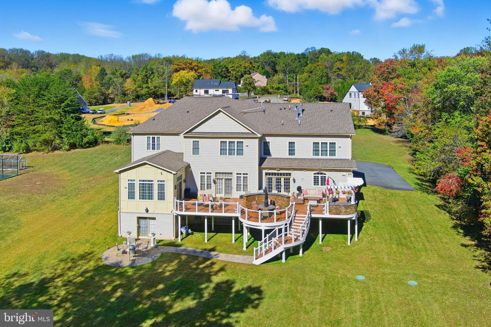 11561 Stuart Mill Road Oakton, VA 22124 - Photo 4 of 75 an aerial view of a house with swimming pool garden and lake view
