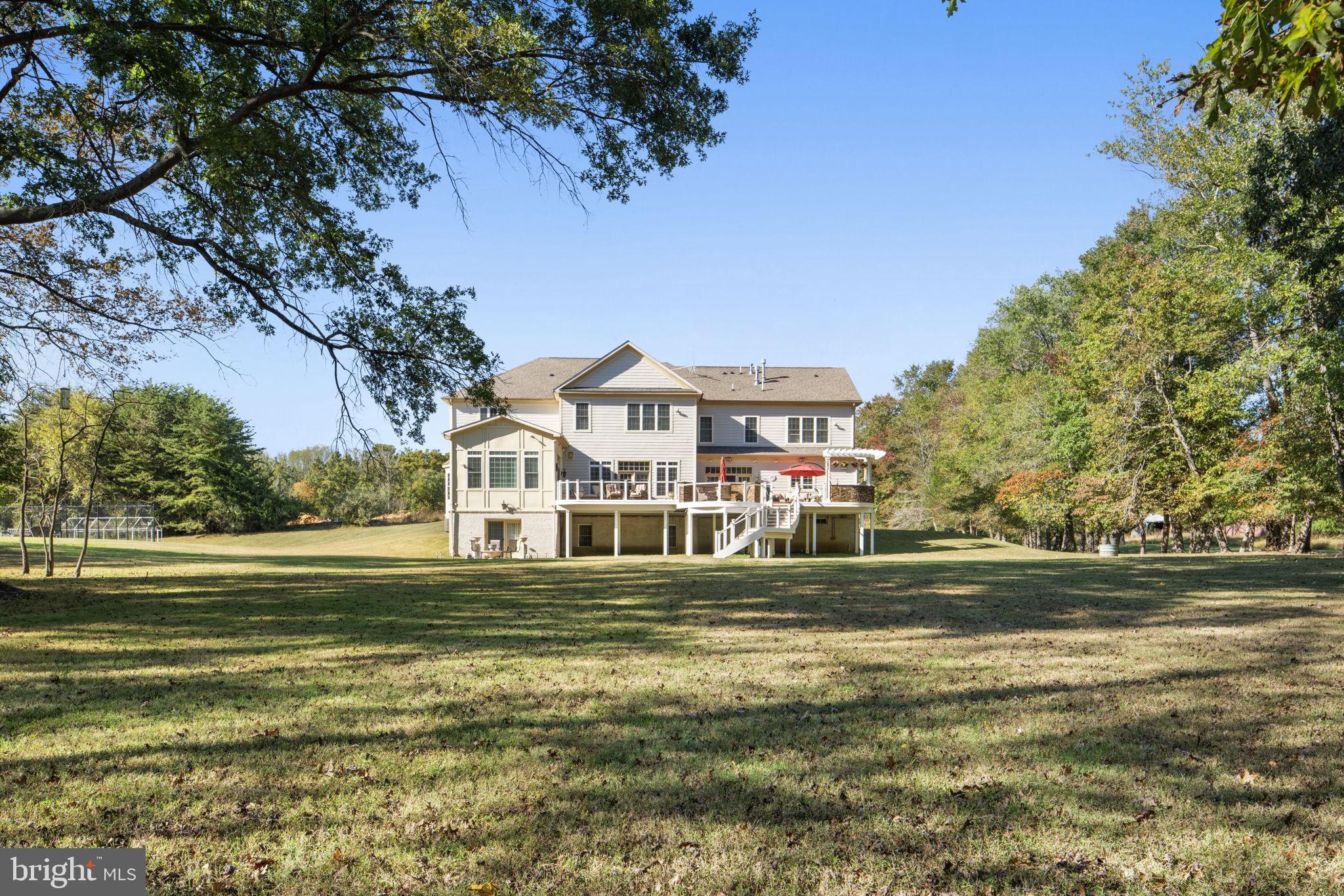 11561 Stuart Mill Road Oakton, VA 22124 - Photo 67 of 75 a front view of a house with a garden