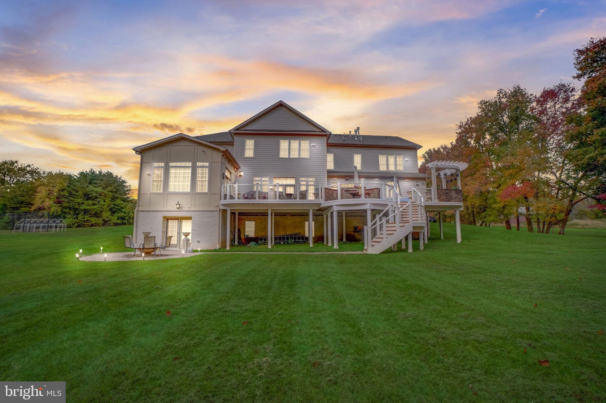 11561 Stuart Mill Road Oakton, VA 22124 - Photo 68 of 75 a front view of a house with a garden