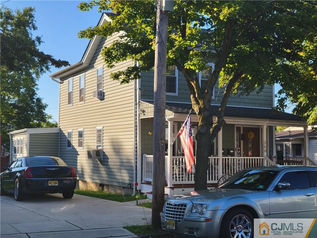 260 Raritan Street South Amboy, NJ 08879 - Photo 1 of 10 a front view of a house with parking space