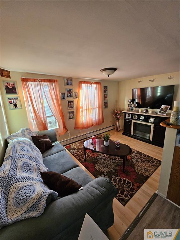 260 Raritan Street South Amboy, NJ 08879 - Photo 6 of 10 a living room with furniture fireplace and a flat screen tv