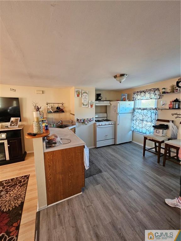 260 Raritan Street South Amboy, NJ 08879 - Photo 7 of 10 a living room with furniture and a wooden floor