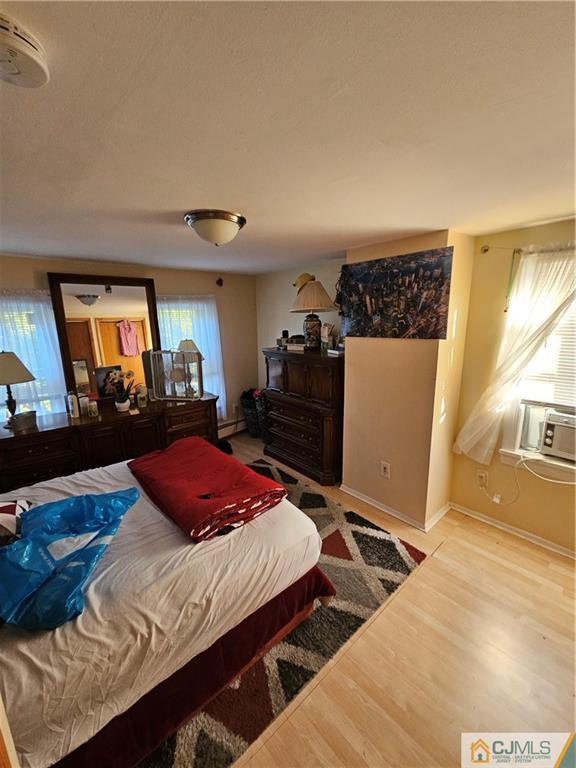 260 Raritan Street South Amboy, NJ 08879 - Photo 9 of 10 a bedroom with bed and window