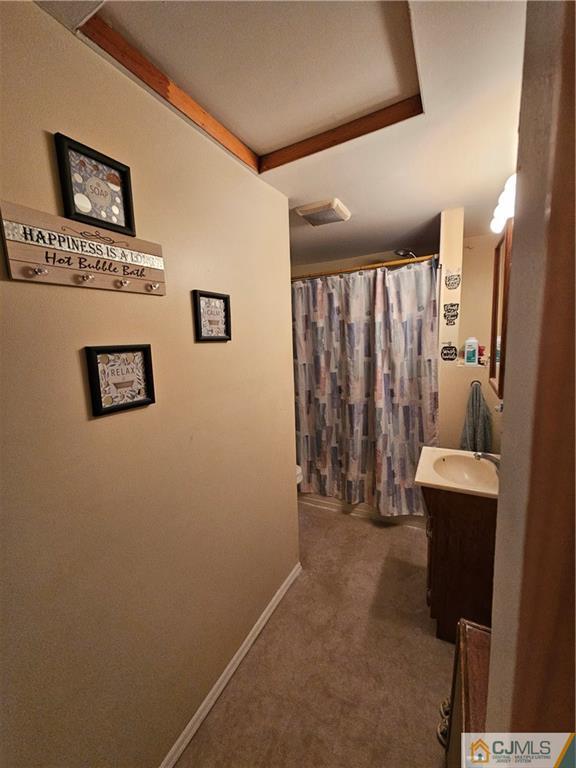 260 Raritan Street South Amboy, NJ 08879 - Photo 10 of 10 a view of a hallway with paintings on the wall