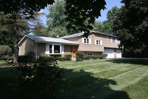 10S276 Alan Road Naperville, IL 60564 - Photo 1 of 1 a front view of house with yard and green space