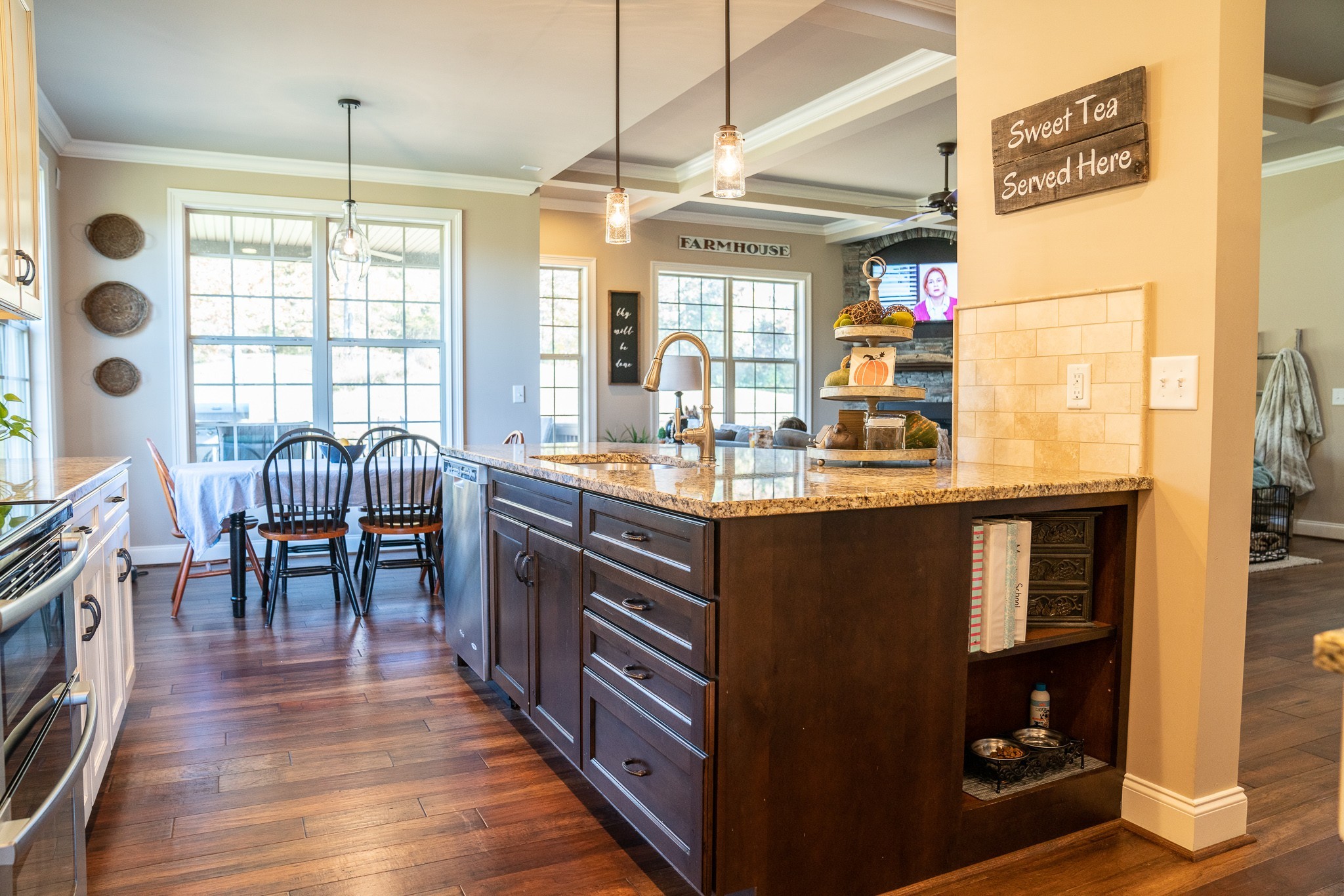615 Brown Road Lebanon, TN 37087 - Photo 8 of 30 a kitchen with granite countertop a stove a dining table and chairs with wooden floor