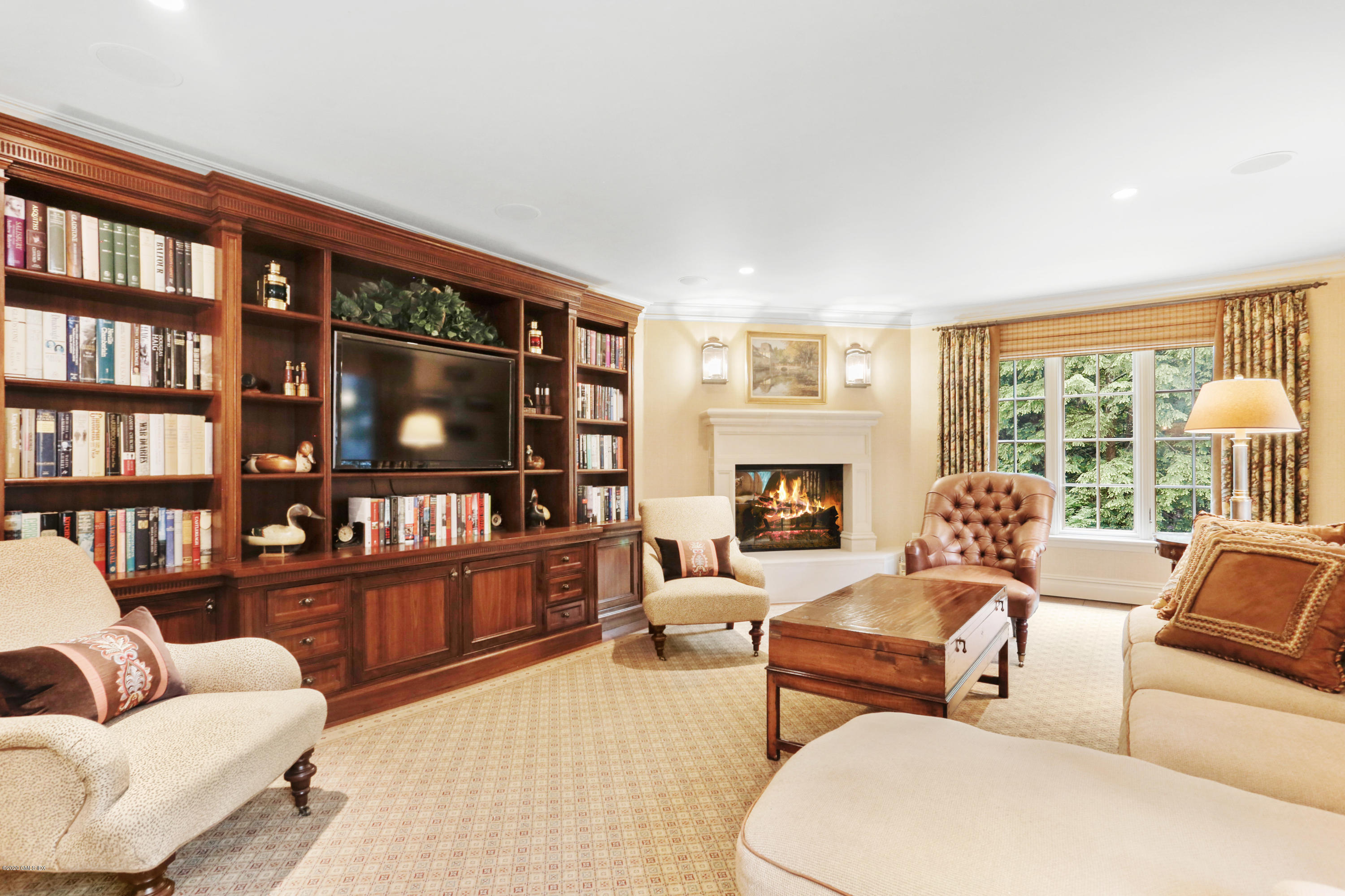 65 Ridgeview Avenue Greenwich, CT 06830 - Photo 17 of 50 a living room with furniture and a book shelf