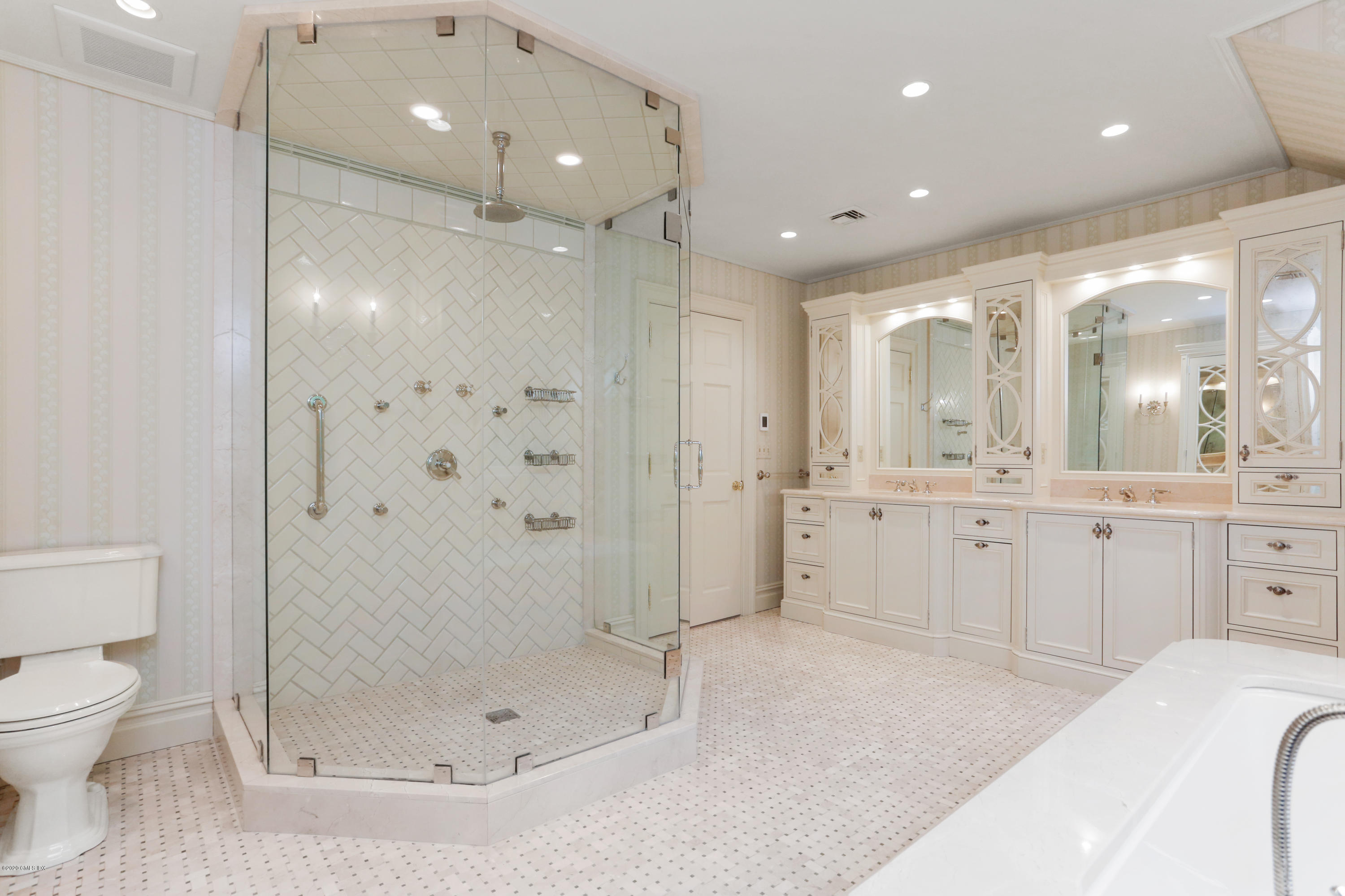 65 Ridgeview Avenue Greenwich, CT 06830 - Photo 23 of 50 a bathroom with a shower a mirror and a sink