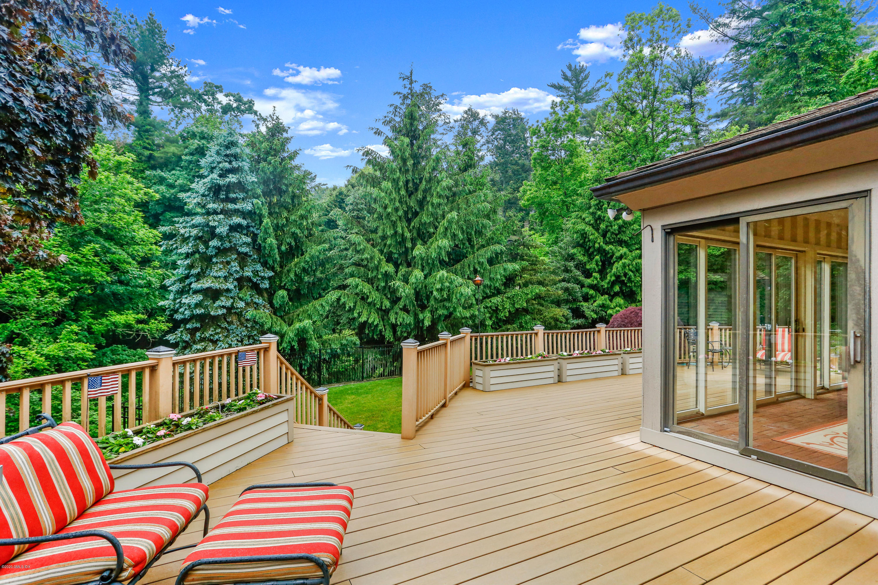 65 Ridgeview Avenue Greenwich, CT 06830 - Photo 29 of 50 a view of a wooden deck with furniture