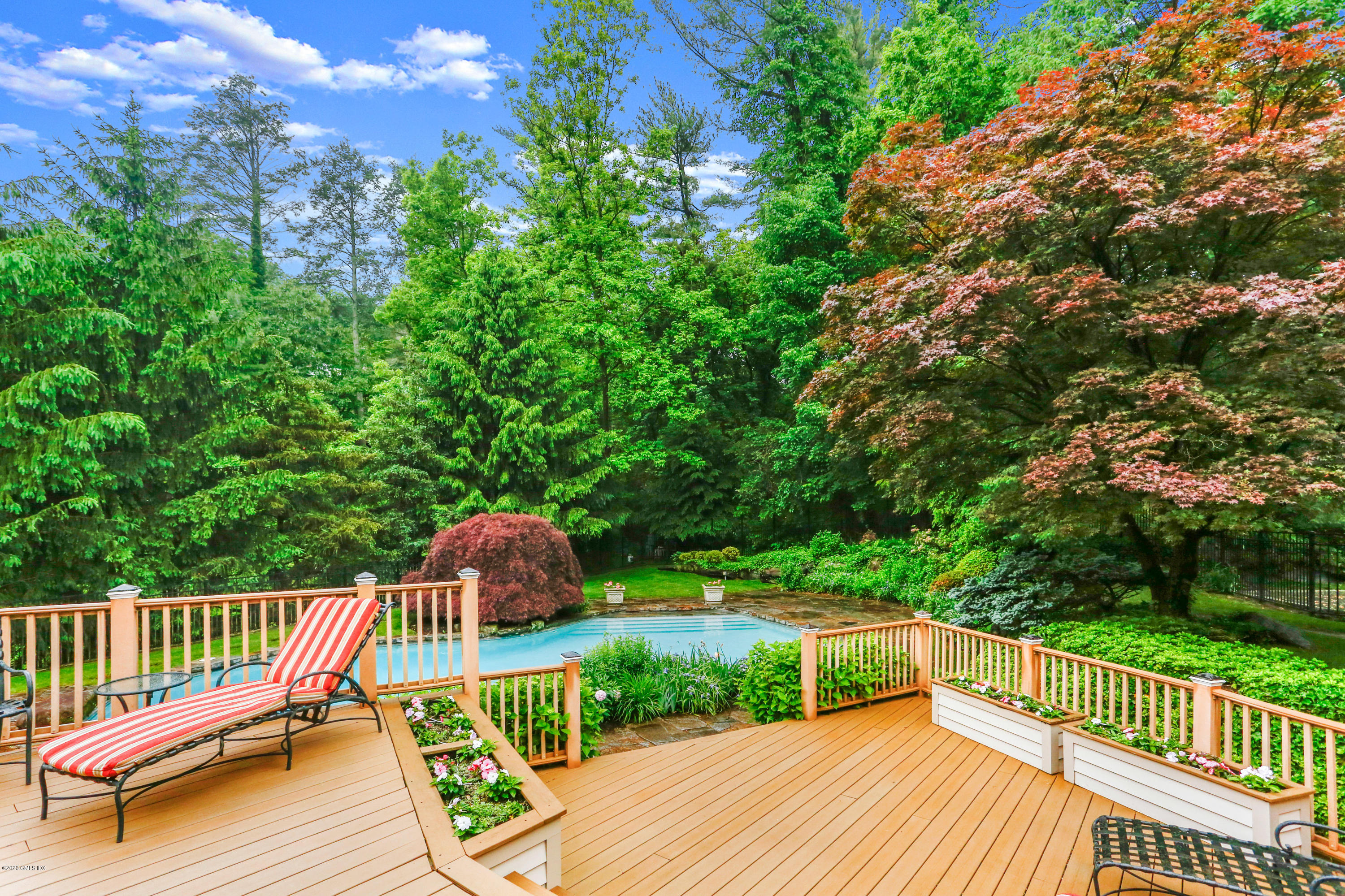 65 Ridgeview Avenue Greenwich, CT 06830 - Photo 31 of 50 a view of a deck with two chairs and a yard