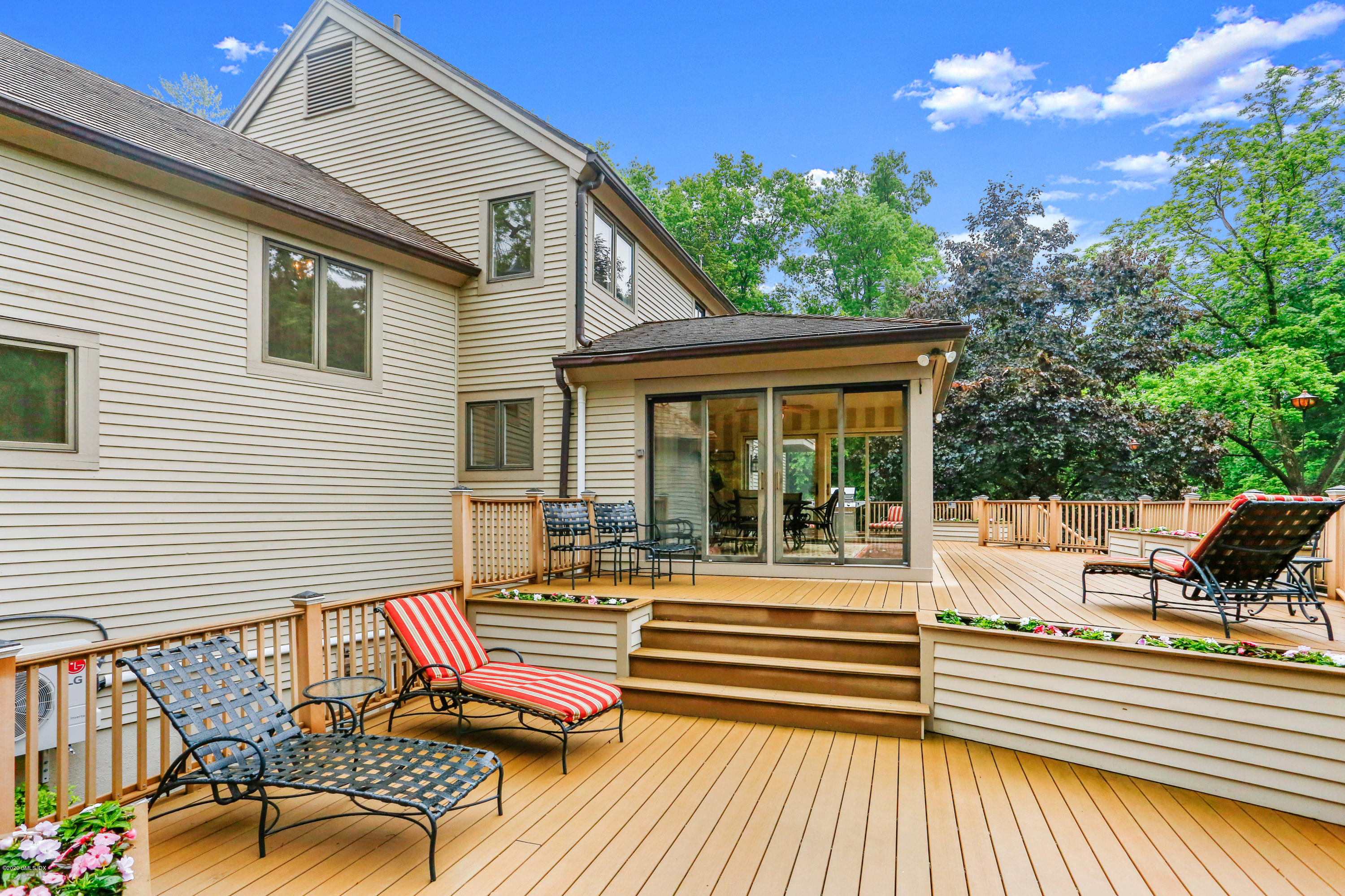 65 Ridgeview Avenue Greenwich, CT 06830 - Photo 32 of 50 a view of a patio with a table and chairs