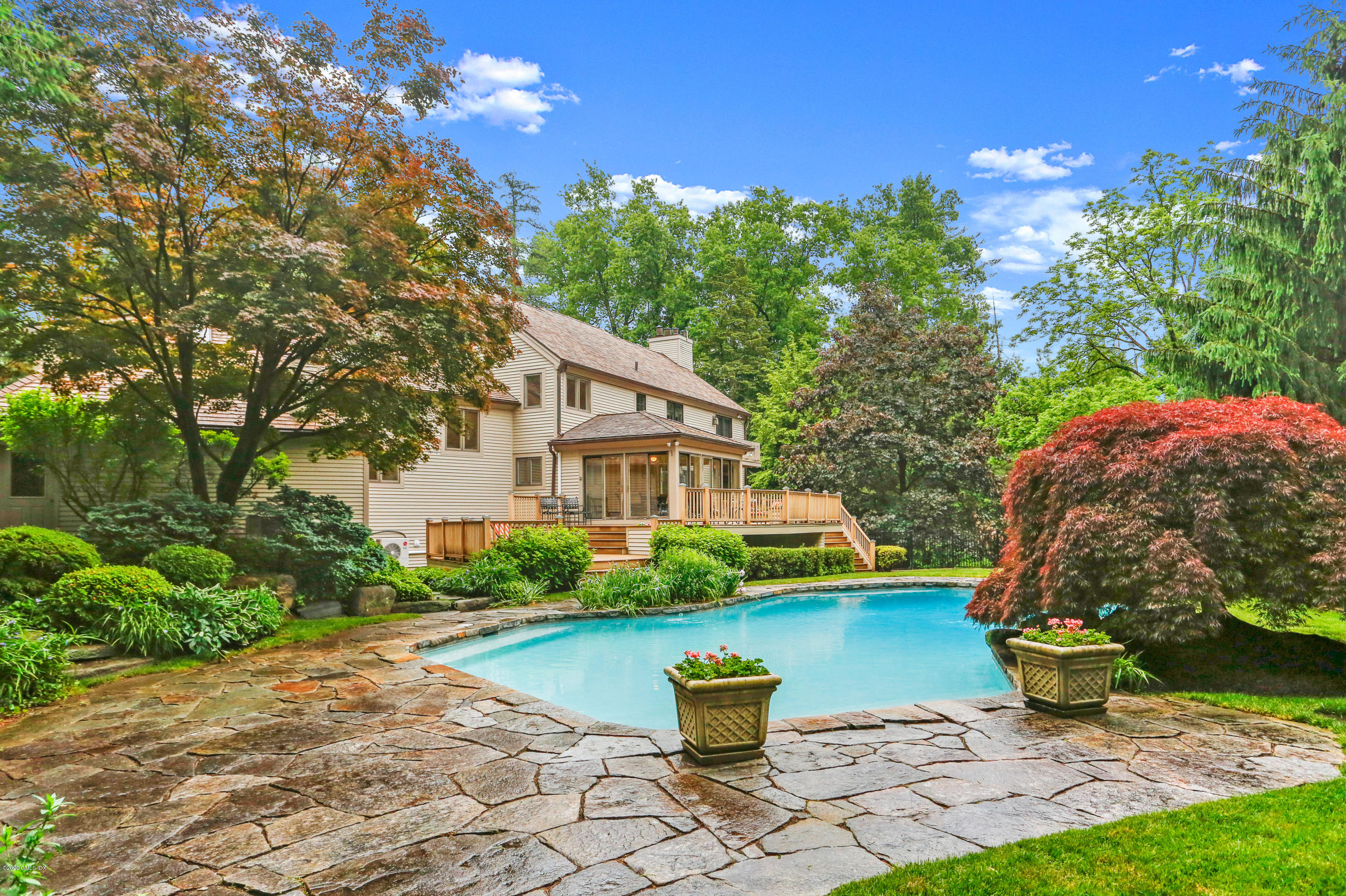 65 Ridgeview Avenue Greenwich, CT 06830 - Photo 35 of 50 a front view of a house with garden