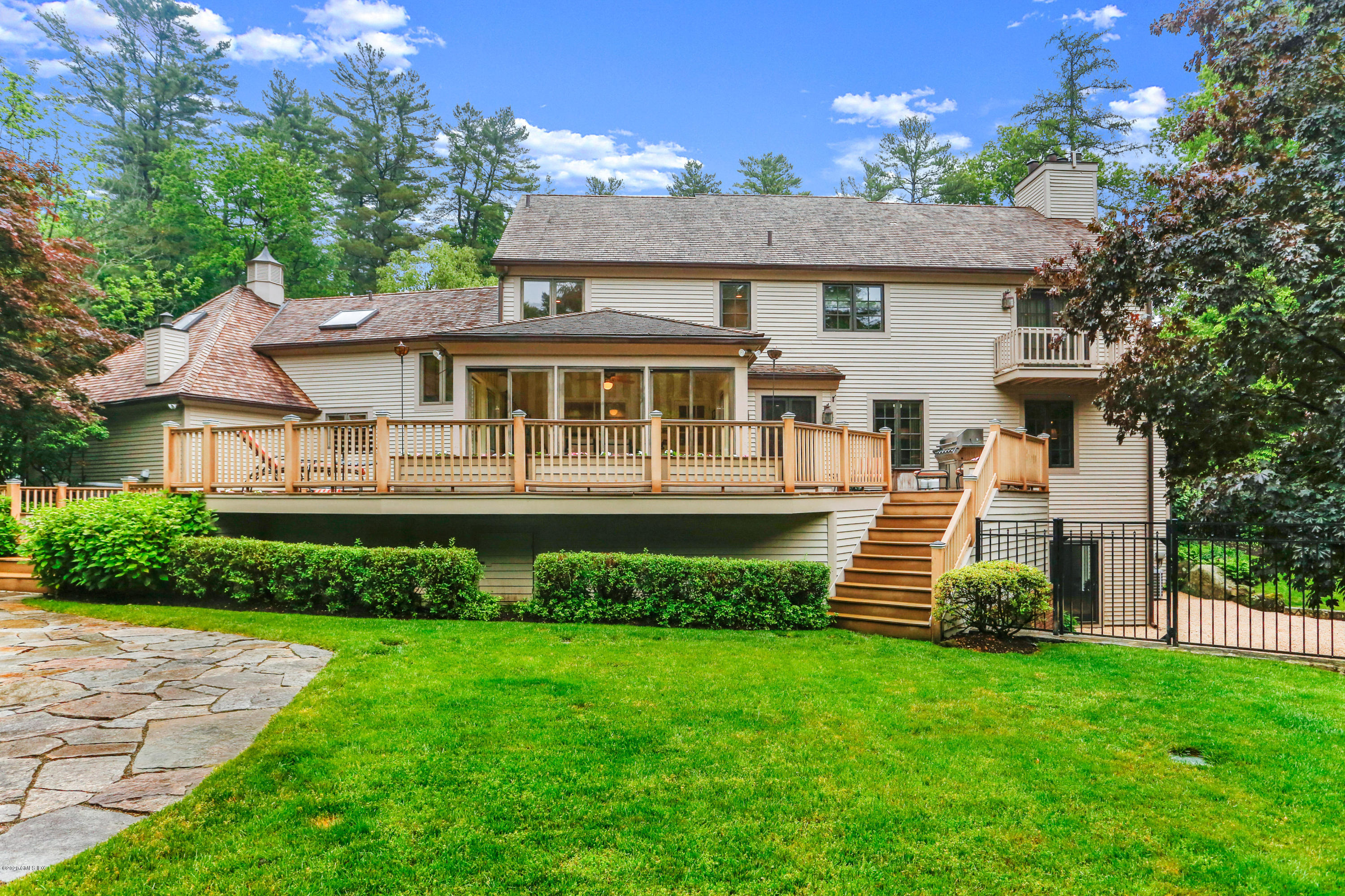65 Ridgeview Avenue Greenwich, CT 06830 - Photo 36 of 50 a front view of a house with a yard and green space