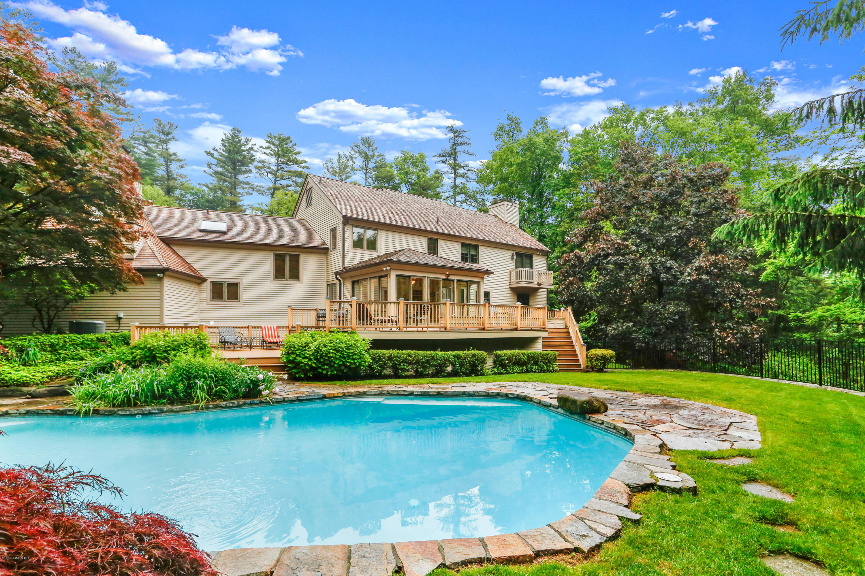 65 Ridgeview Avenue Greenwich, CT 06830 - Photo 37 of 50 a view of a house with swimming pool and sitting area