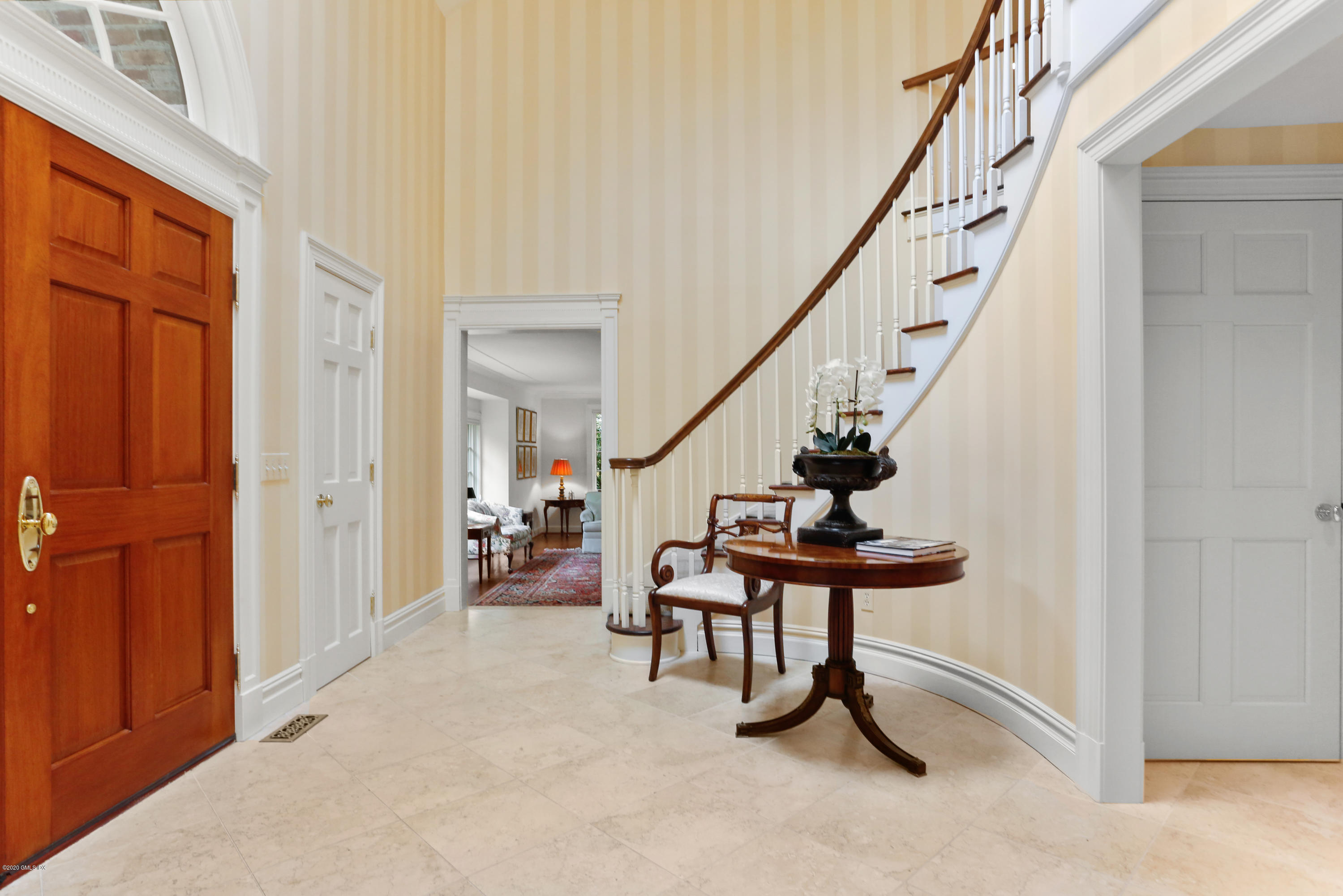 65 Ridgeview Avenue Greenwich, CT 06830 - Photo 4 of 50 a view of an entryway with wooden floor and stairs