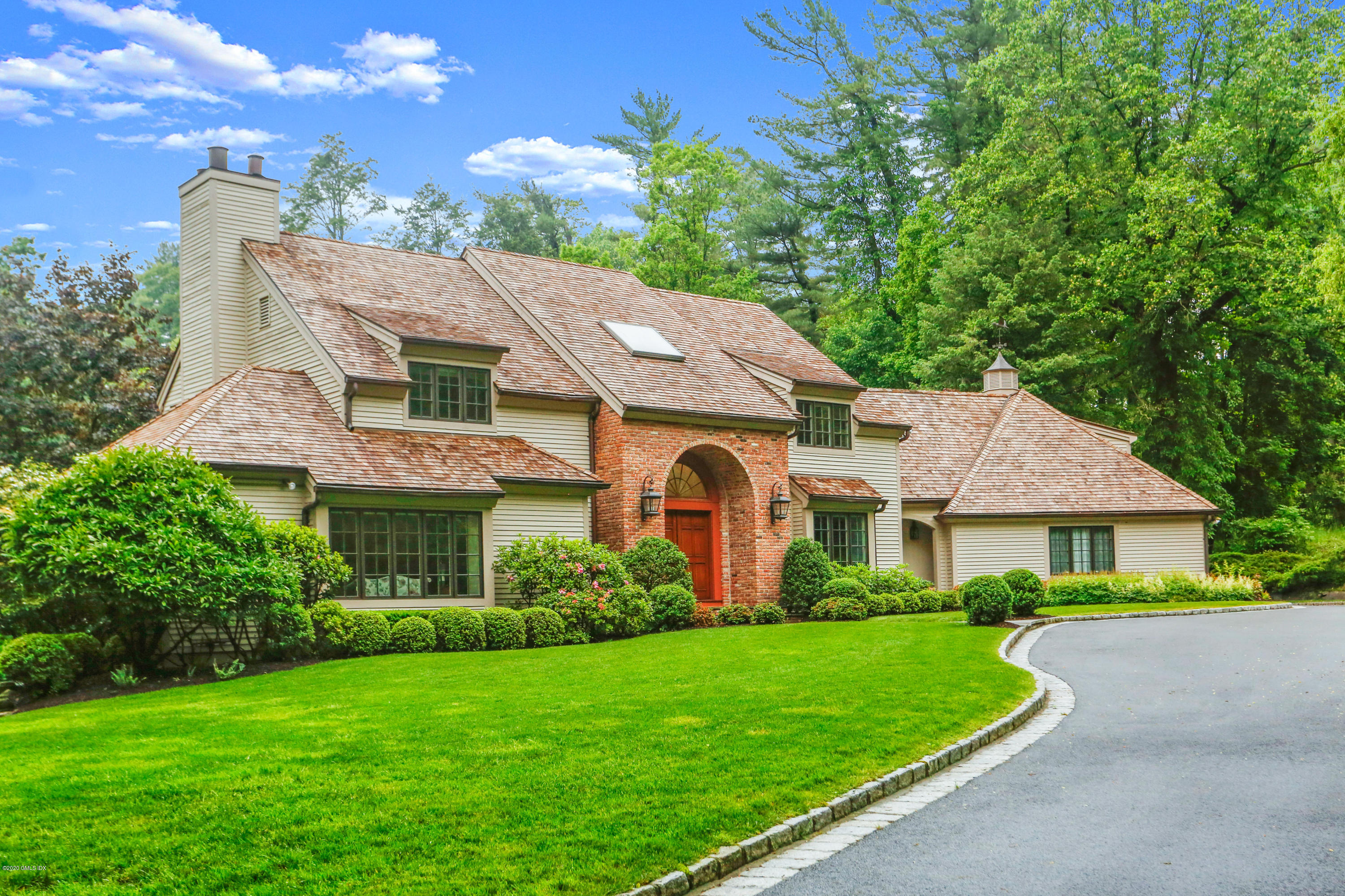 65 Ridgeview Avenue Greenwich, CT 06830 - Photo 45 of 50 a front view of a house with a yard