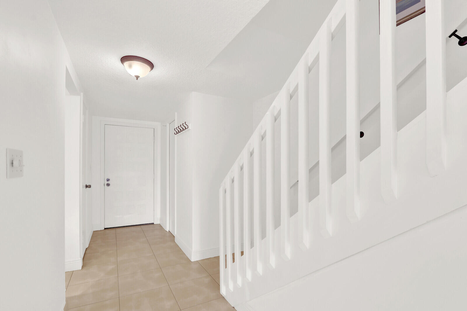 353 Highway 1, Unit D105 Jupiter, FL 33477 - Photo 20 of 56 a view of a hallway with staircase