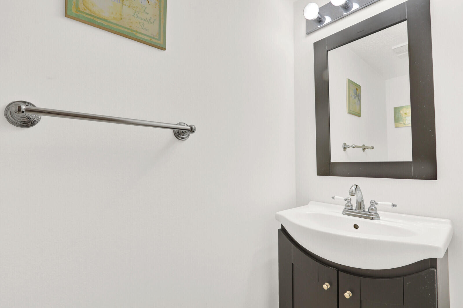 353 Highway 1, Unit D105 Jupiter, FL 33477 - Photo 21 of 56 a bathroom with a sink and a mirror