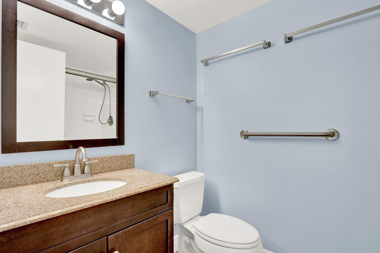353 Highway 1, Unit D105 Jupiter, FL 33477 - Photo 29 of 56 a bathroom with a granite countertop sink toilet and shower