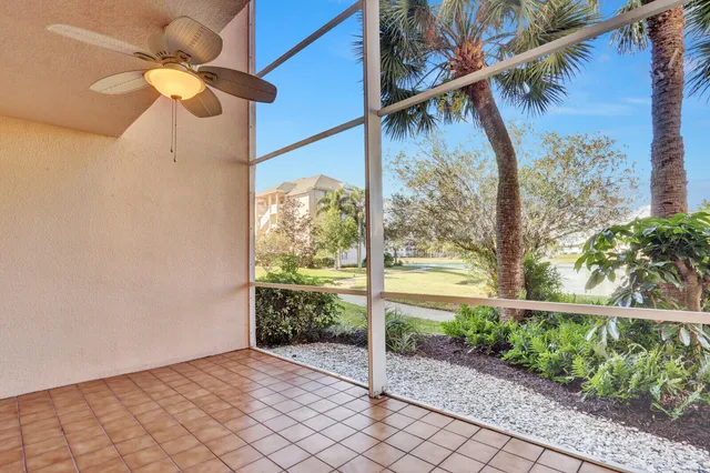 a view of a pathway with a tree in a yard