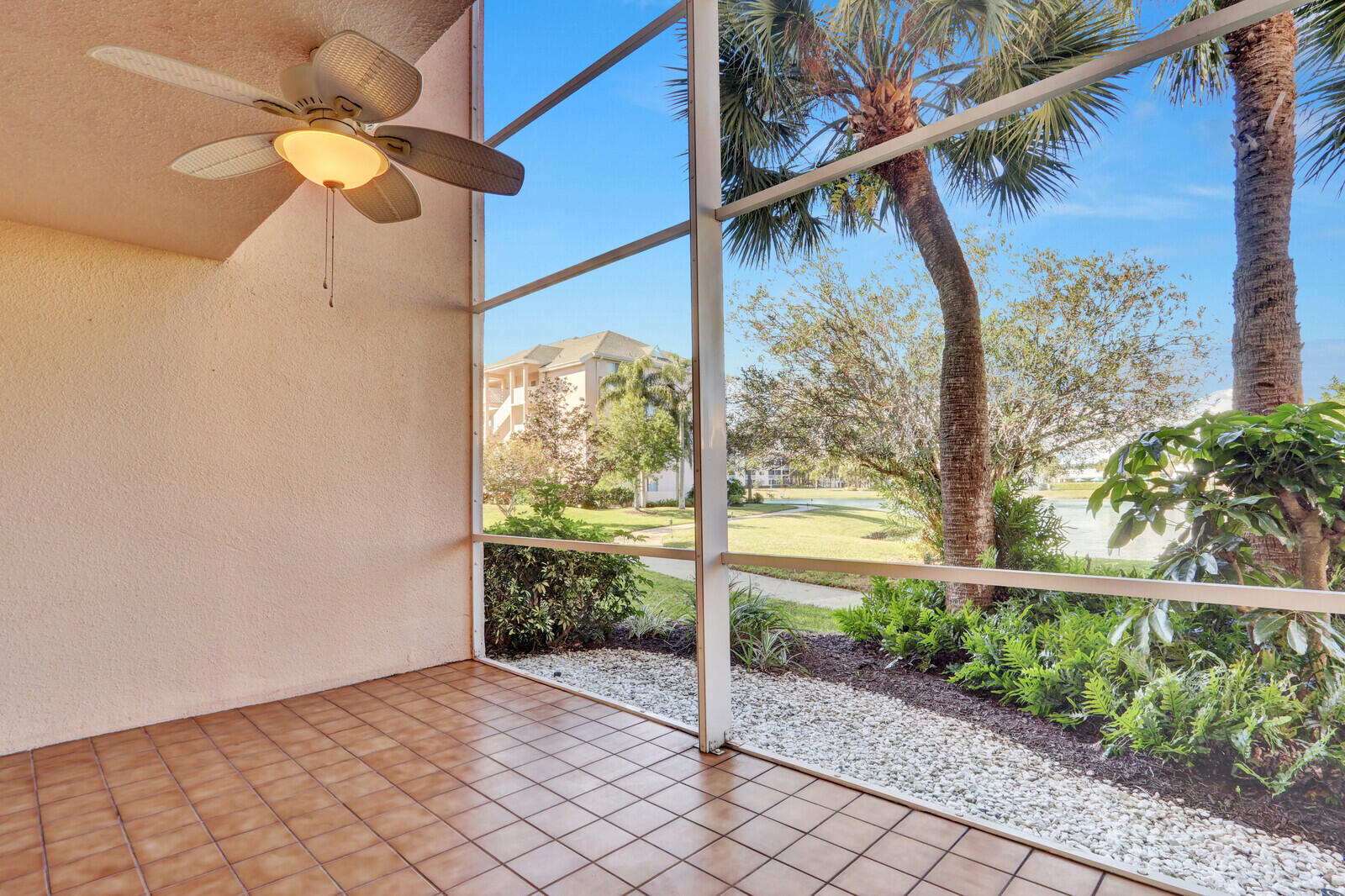353 Highway 1, Unit D105 Jupiter, FL 33477 - Photo 3 of 56 a view of a pathway with a tree in a yard