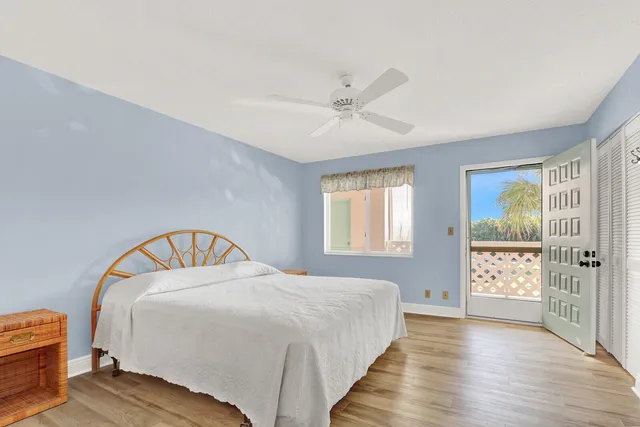a bedroom with a bed and cabinets
