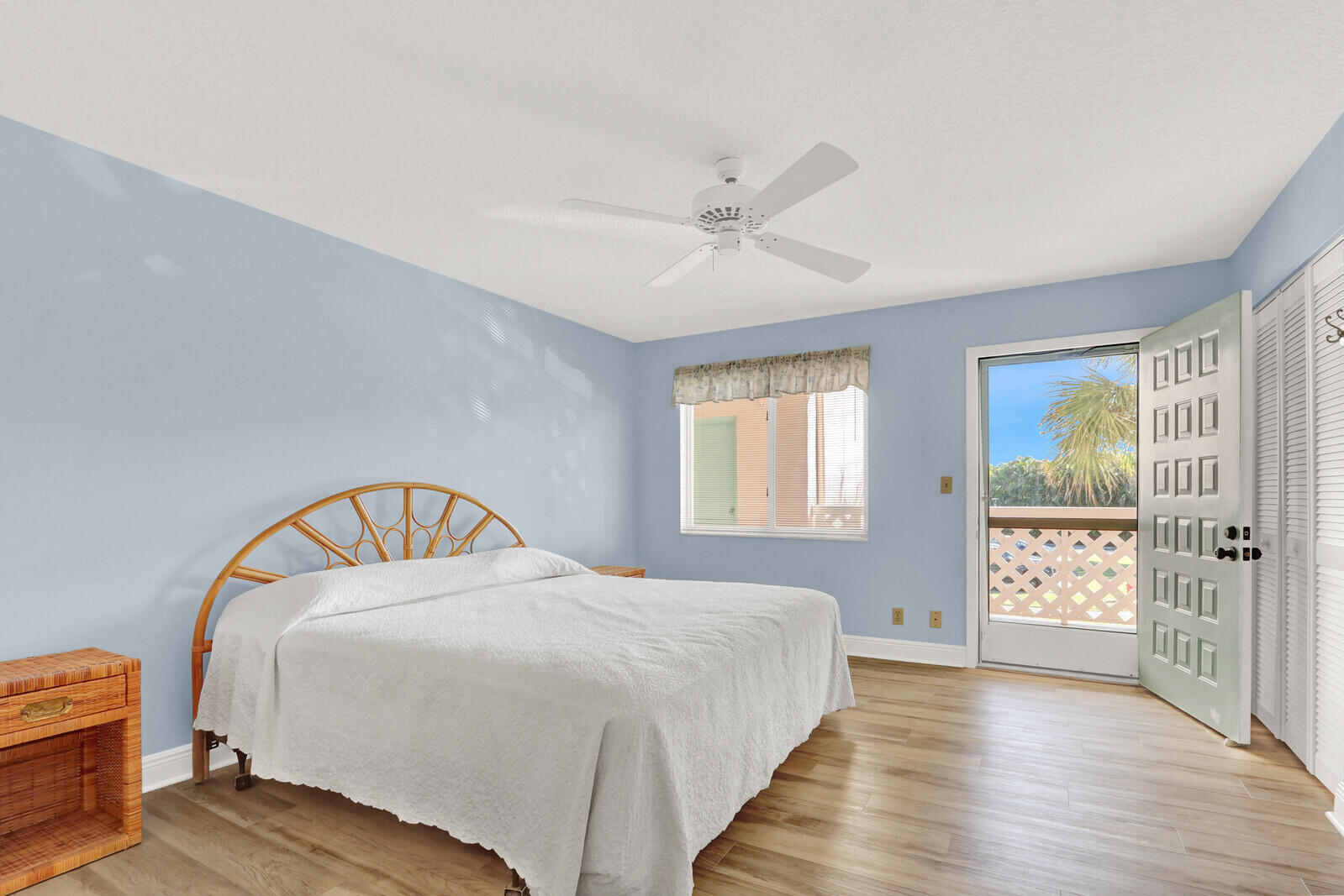 353 Highway 1, Unit D105 Jupiter, FL 33477 - Photo 31 of 56 a bedroom with a large bed and a chandelier