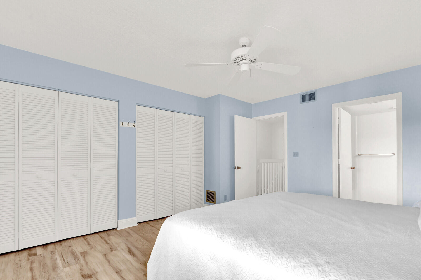 353 Highway 1, Unit D105 Jupiter, FL 33477 - Photo 33 of 56 a bedroom with a bed and cabinets