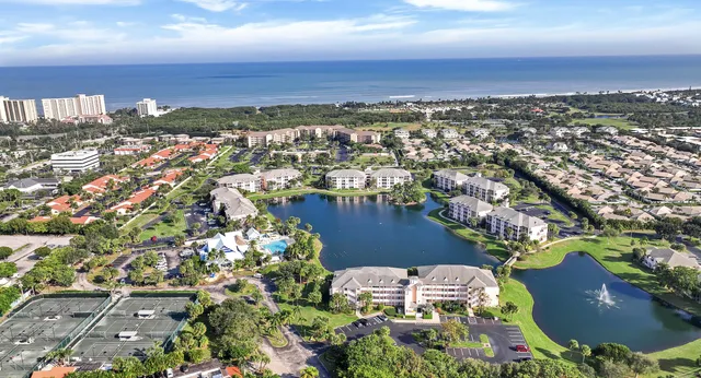 an aerial view of a house with a lake view