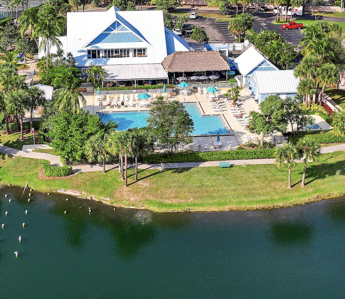 353 Highway 1, Unit D105 Jupiter, FL 33477 - Photo 40 of 56 an aerial view of residential houses with outdoor space and swimming pool
