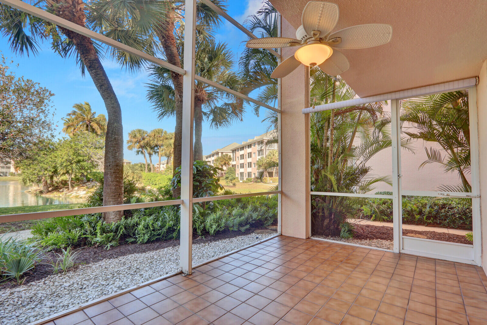 353 Highway 1, Unit D105 Jupiter, FL 33477 - Photo 4 of 56 a view of a room with wooden floor and iron fence