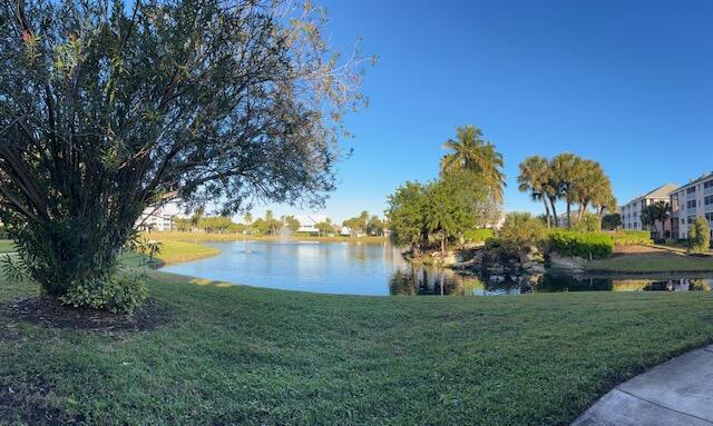 353 Highway 1, Unit D105 Jupiter, FL 33477 - Photo 42 of 56 a view of a lake with houses in the back