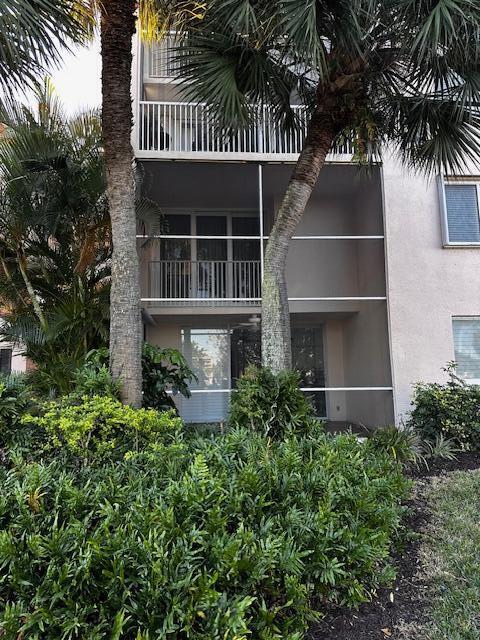 353 Highway 1, Unit D105 Jupiter, FL 33477 - Photo 43 of 56 front view of a house with a yard