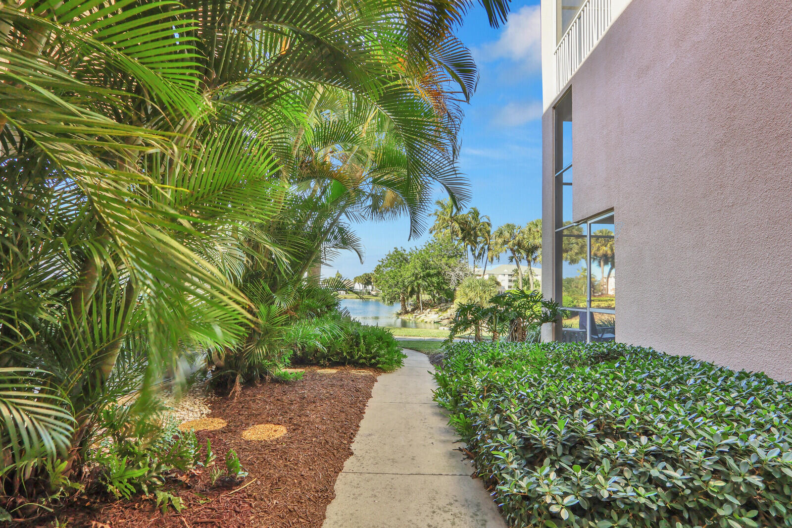 353 Highway 1, Unit D105 Jupiter, FL 33477 - Photo 46 of 56 a view of a yard with plants