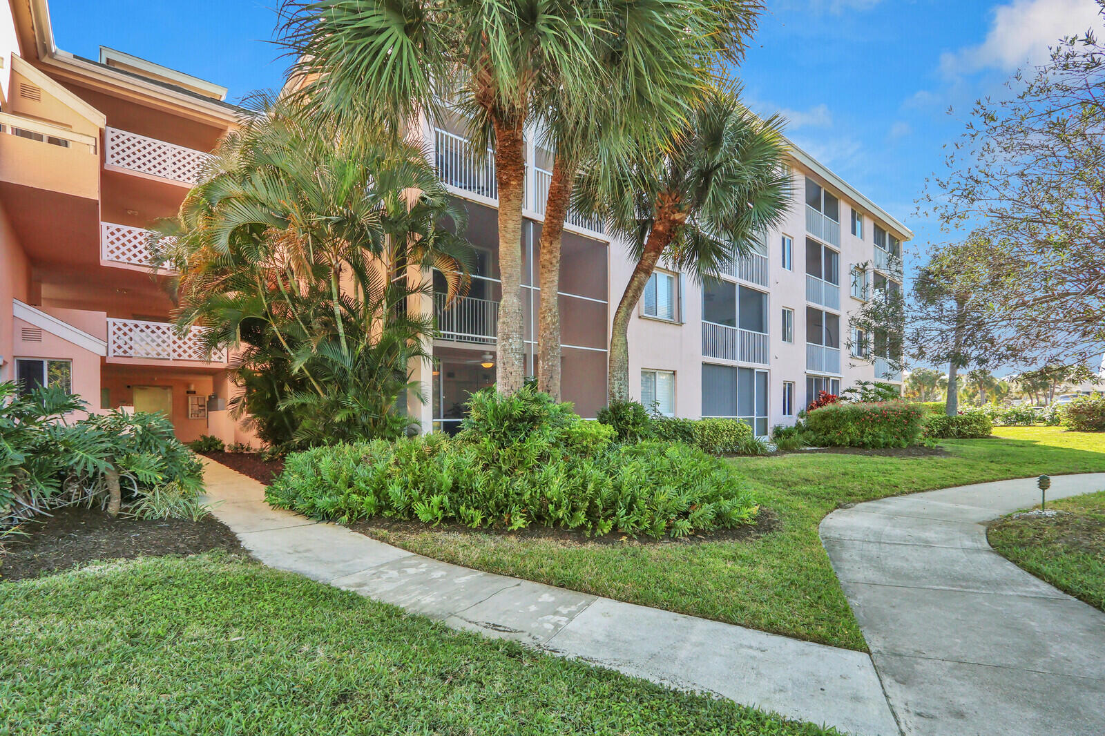 353 Highway 1, Unit D105 Jupiter, FL 33477 - Photo 47 of 56 a view of a building with a yard